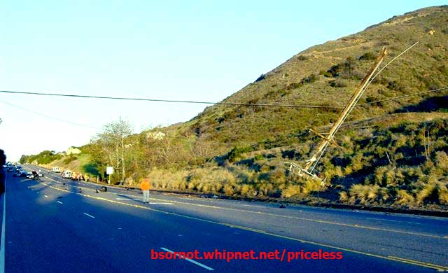 4 lane road, damaged light pole, damage telephone pole, ferrari crash